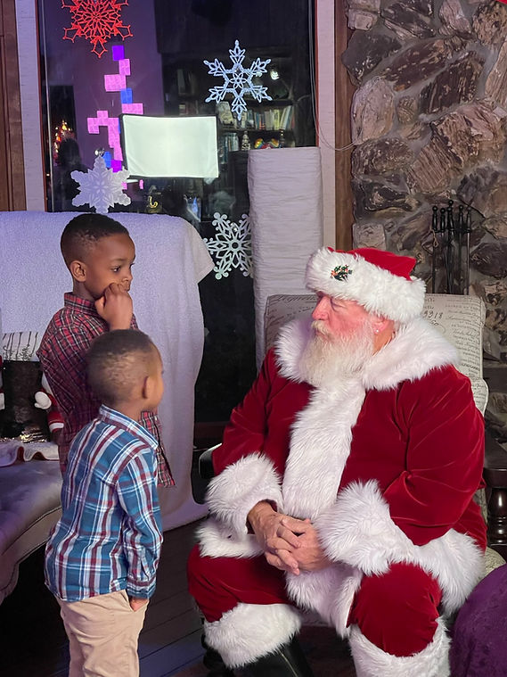 Santa talks with brothers.JPG