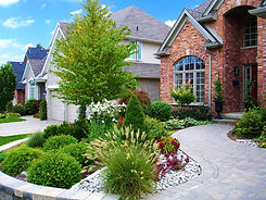 Elegant brick home with stone walkway and lush landscaping, superior landscape main.