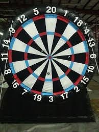 Take turns throwing velcro covered balls instead of darts at this large bullseye board