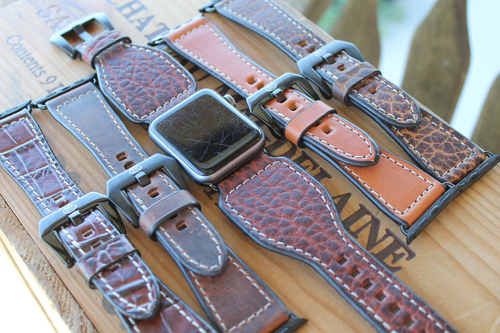 Eye-level view of a variety of leather watchbands in different colors and textures