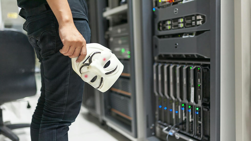 Person holding anonymous mask near servers, hinting at cybersecurity and hacking themes.