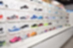 Wall of various tennis court shoes
