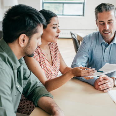 Couple at table reviewing PMI 
