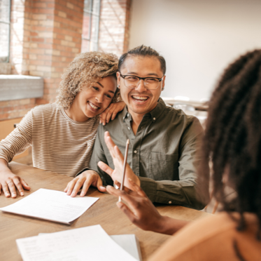 Couple talking about mortgage options with Loan Officer