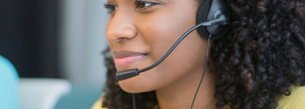 Friendly Travel Support Agent Assisting Customers Online
