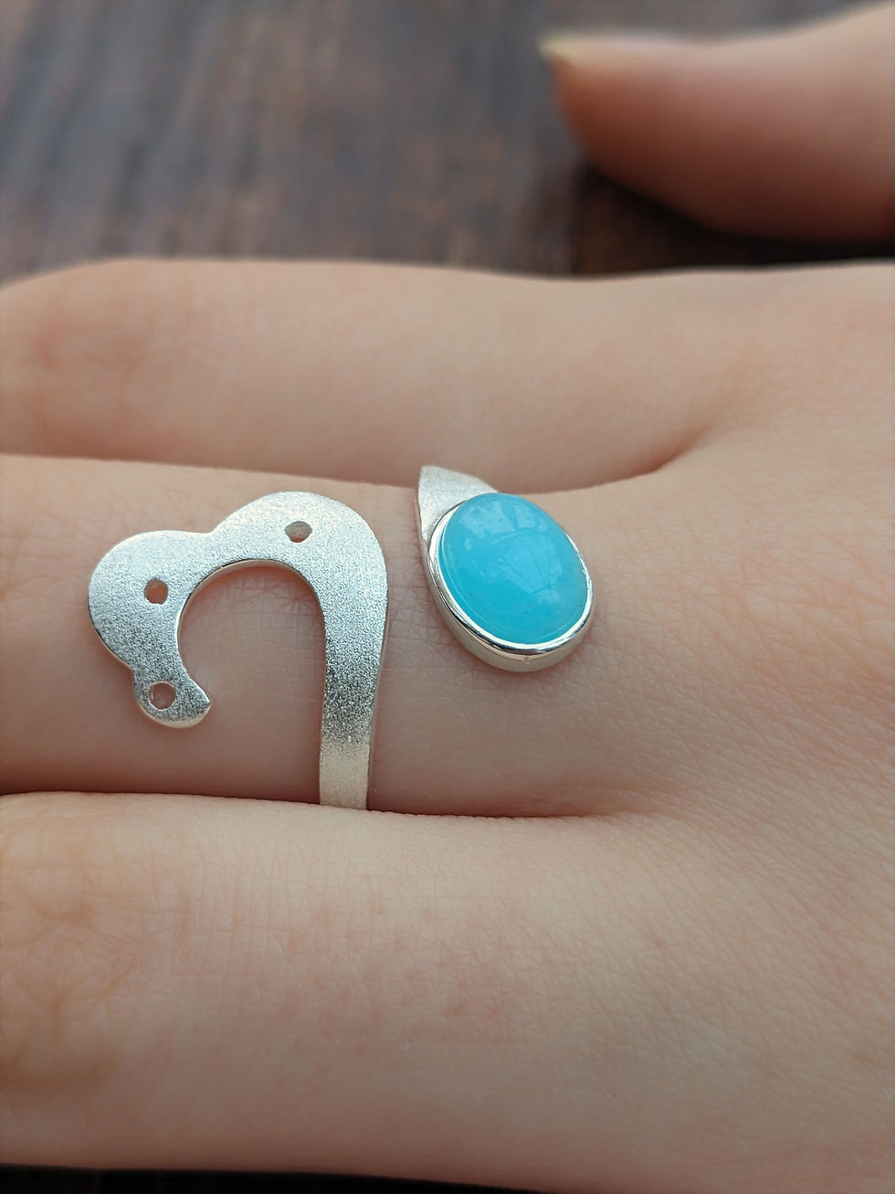 Hand Wears Blue Crystal Silver Swan Lake Ring