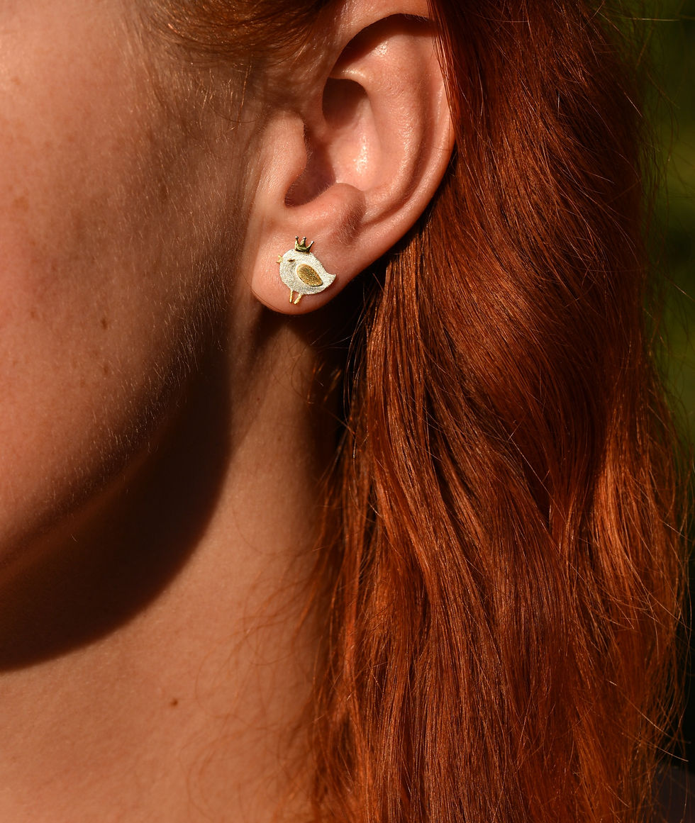 Lady wearing Queen of the birds earrings