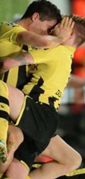 Marco Reus and Lewandoski hugging cropped.jpg