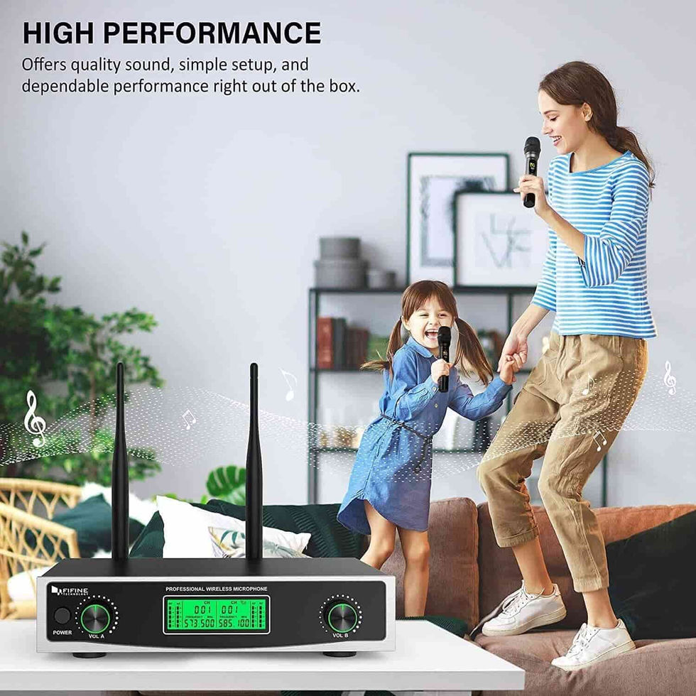 A woman playing happily with its child and a wireless microphone
