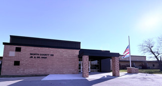North County HS JR & SR High building, American flag waving in the wind.