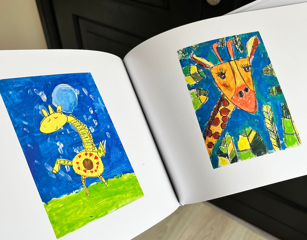 Eye-level view of a coffee table book open to colourful children's drawings