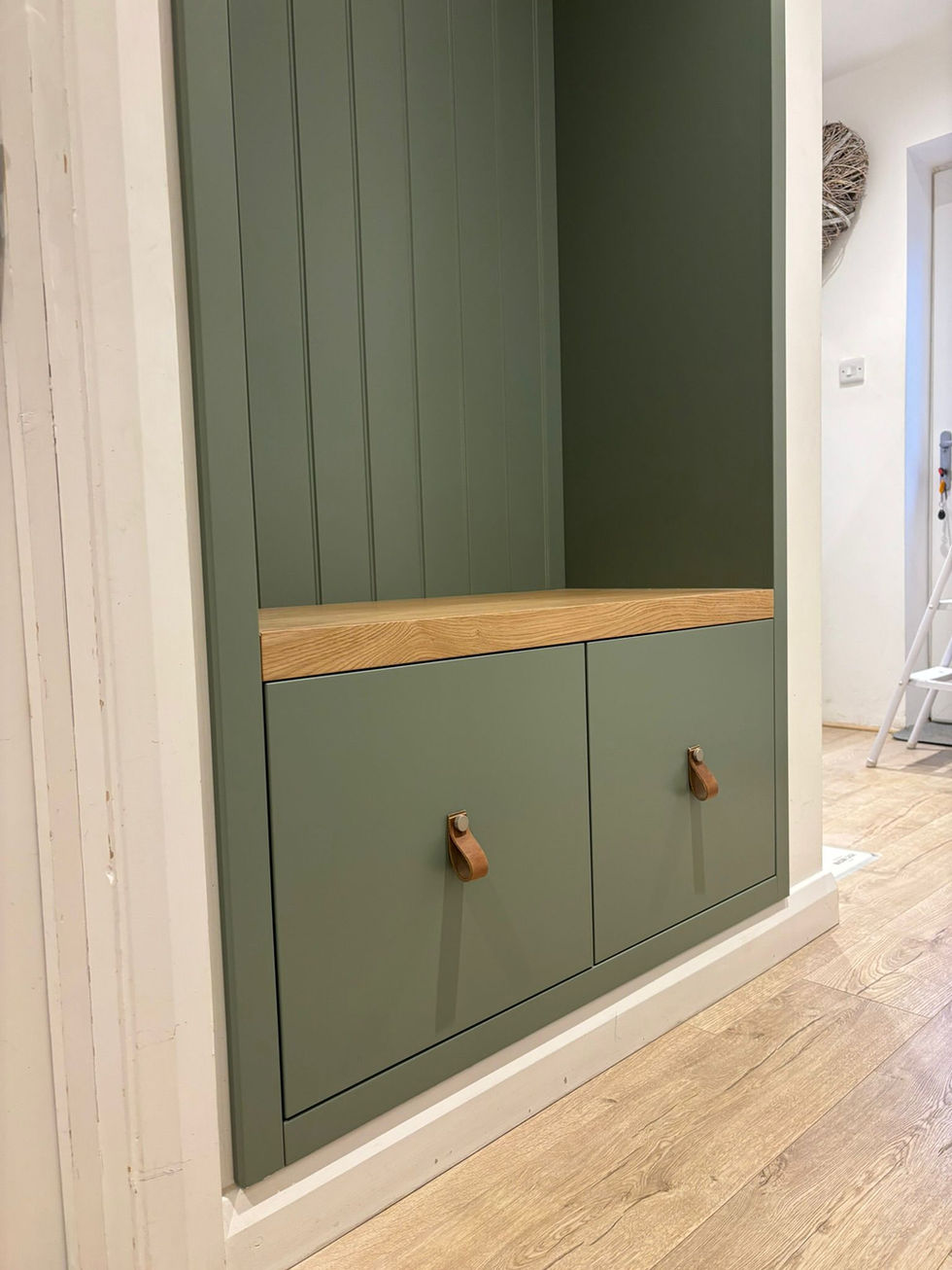 Painted hallway bench with hidden storage and wall panelling detail.