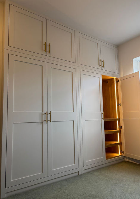 Detail view of fitted wardrobe doors and surrounding joinery finish.