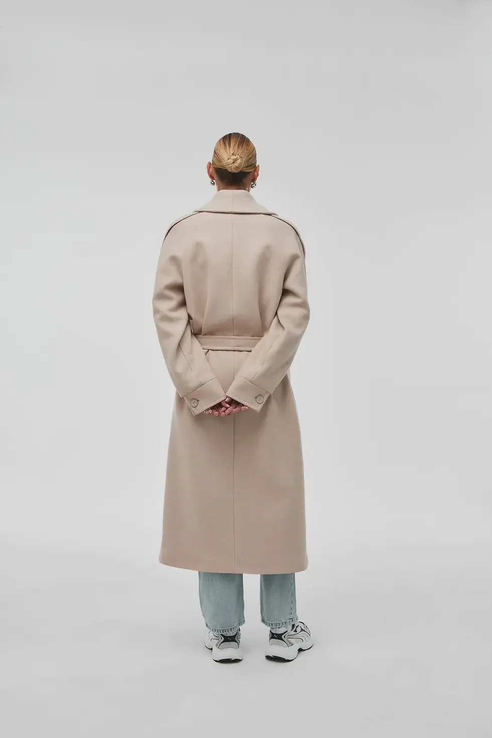 Thumbnail: Interior lining of the Odesa Cream Wool Coat - artificial silk and satin blend.