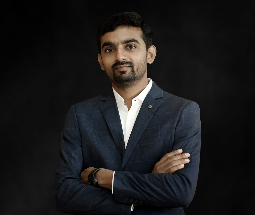 Man in suit with arms crossed