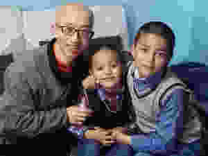 Chinese dissident Hu Jia (L) with jailed Uyghur scholar Ilham Tohti's two sons, in undated photo. Photo courtesy of Hu Jia.