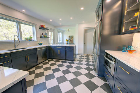 Renovated kitchen with beautiful recessed lighting and checkered floor
