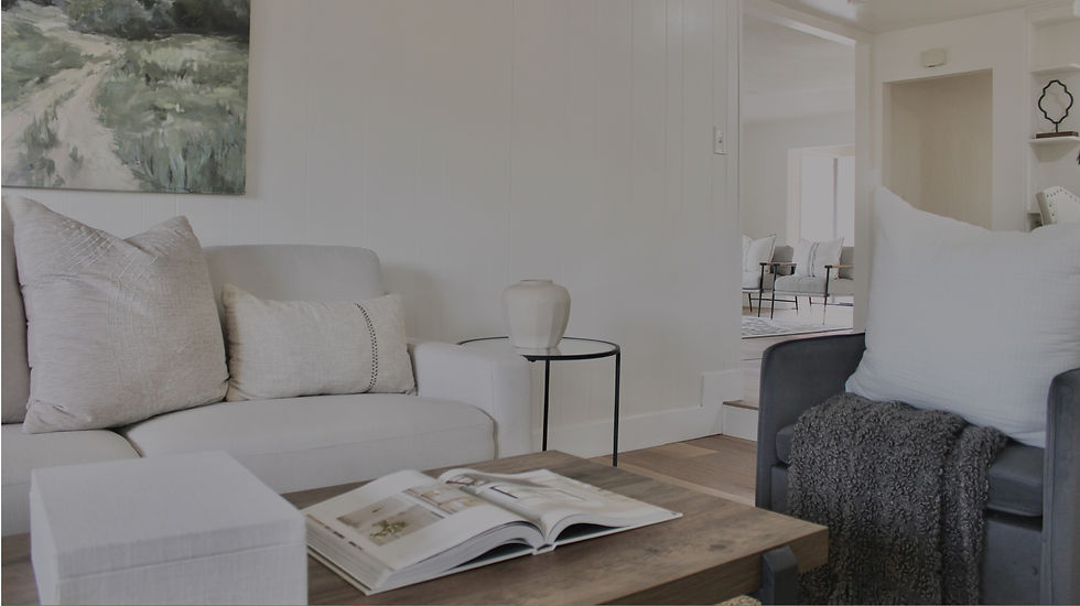 Apex Real Investments Fix and Flip Property Result. A beautifully repainted living room, with new wooden floors and overhead light features.