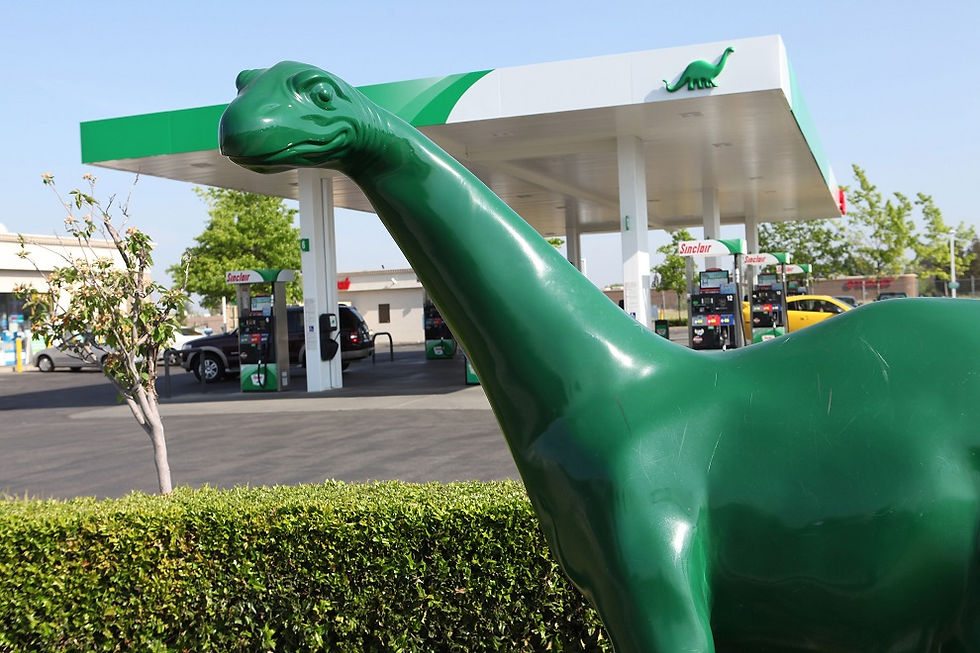 A Sinclair gas station with its iconic green dinosaur.