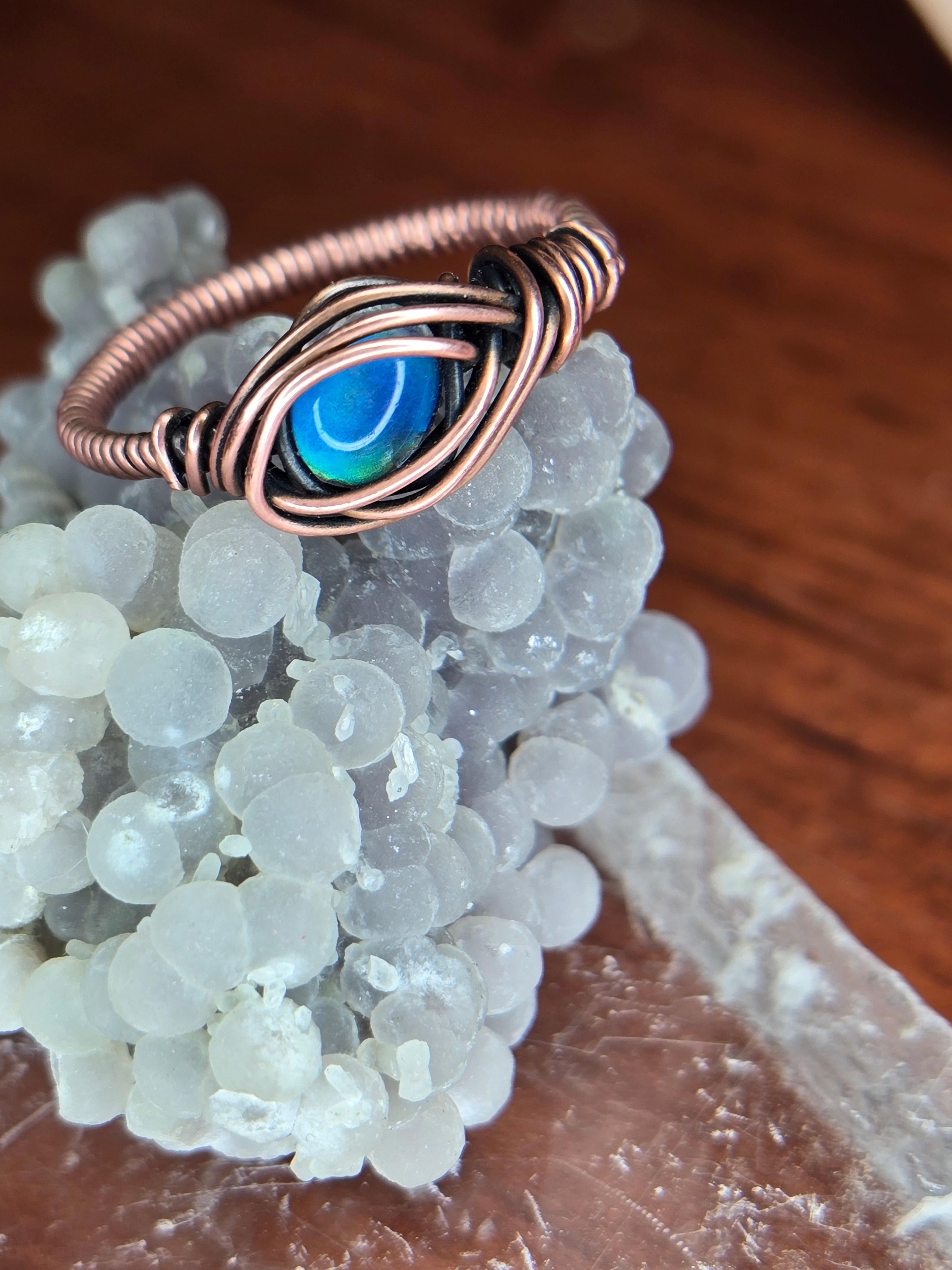 Heat changing gem in copper ring