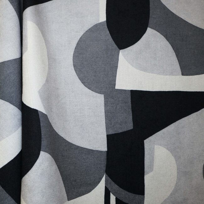 Otto fabric featuring overlapping large-scale geometric shapes in a contemporary abstract print on durable polyester.