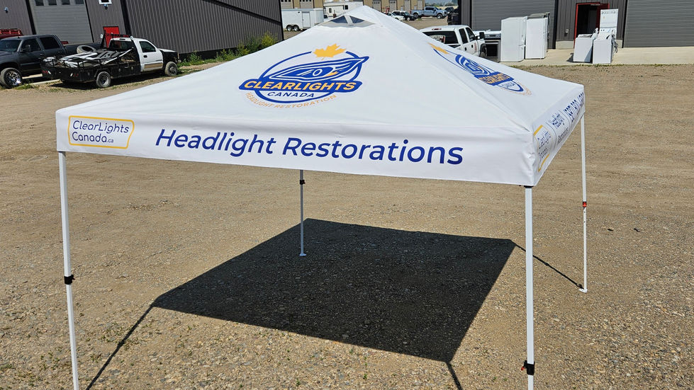 Front view of custom ClearLights Canada tent with “Headlight Restorations” text and sewn vinyl panels.