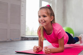 blonde-young-smiling-girl-doing-fitness-exercise.jpg