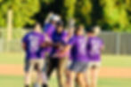 Eye-level view of a kickball on a grassy field ready for a game