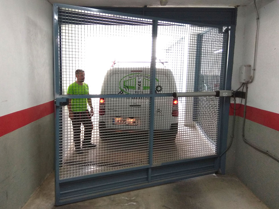puerta abatible comunidad motorizada batiente motor garaje automatismos toni rota cadiz.jpg