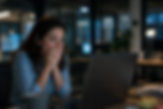 Employee experiencing AI fear while looking at a laptop in an office, reflecting concerns about artificial intelligence