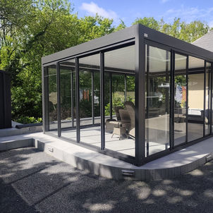 Freestanding Bioclimatic pergola with glass surrounding fitted in Longford