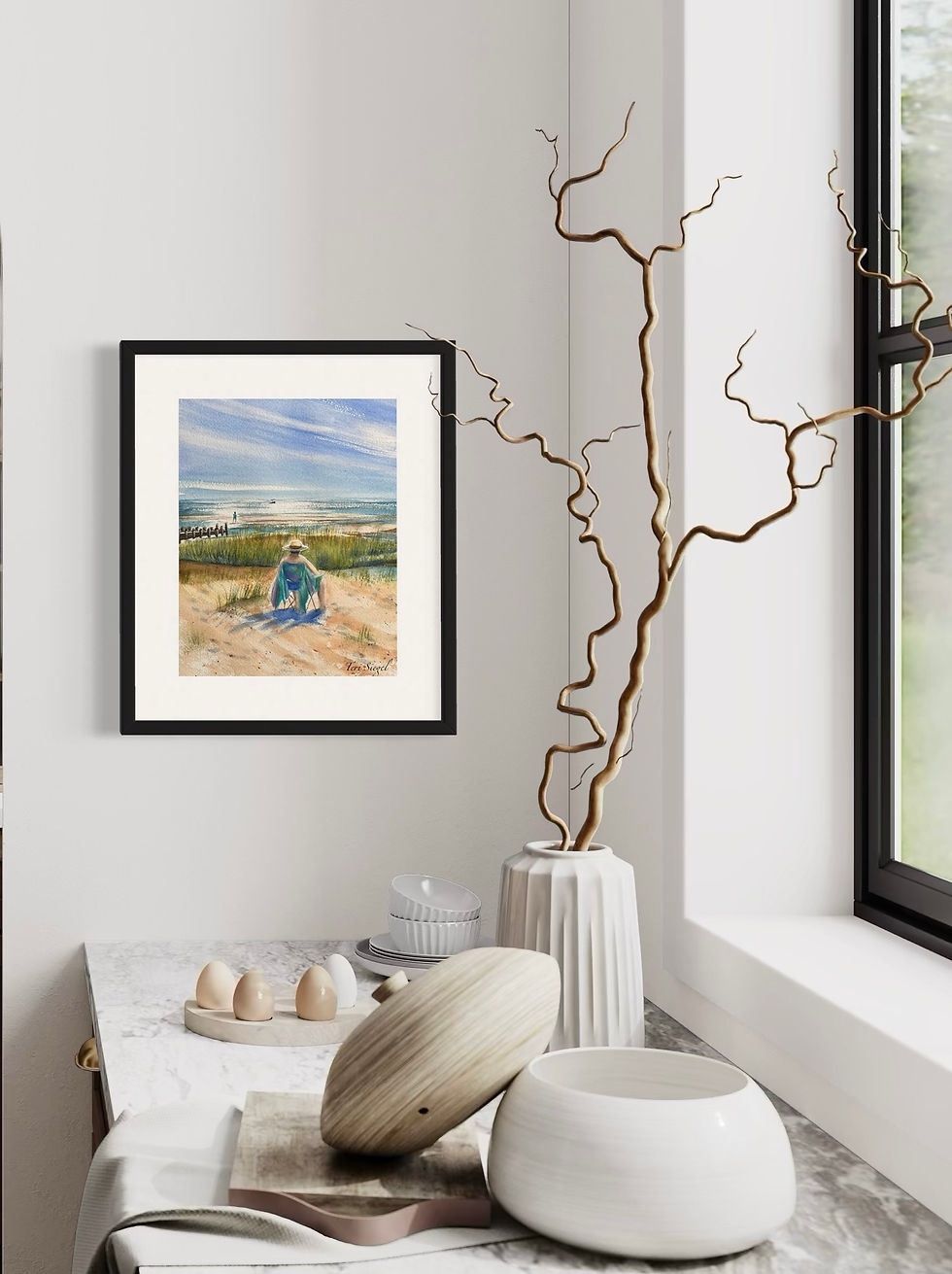 Thumbnail: framed watercolor painting of a man sitting on the beach, by the water, on a bright sunny day