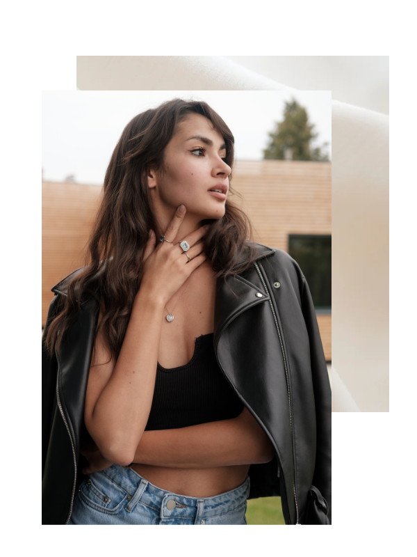 Woman touching her neck looking off camera. 