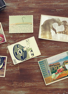 vintage photos and drawings on a wooden surface