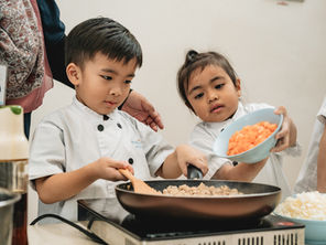 Children work with real culinary tools during our monthly cookery sessions.