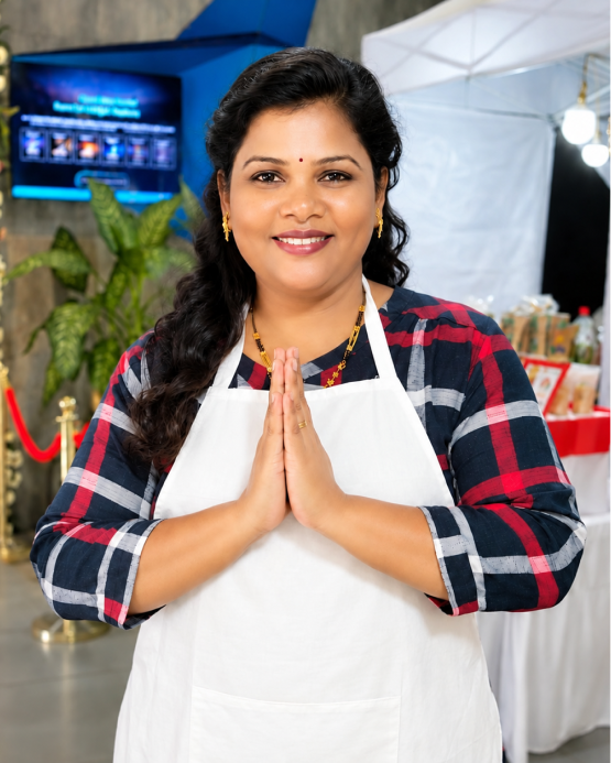 Image (Madhura, founder of Sehat by Madhura, in her Kitchen Krafts apron)