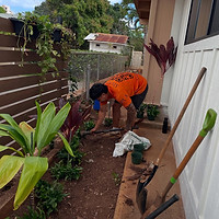 worker trenching the yard space