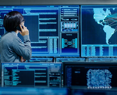 In the System Control Room IT Administrator Talks on the Phone. He's in a High-Tech Facili