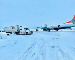 Well-maintained Dry van from Kiara Transport on snowy Airport Runway