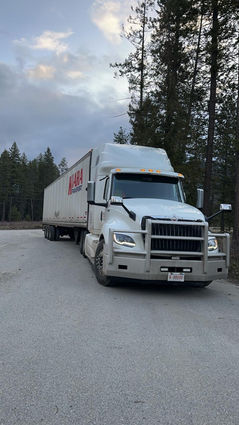 Reliable freight transport on Alberta highway by Kiara Transport