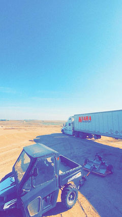 Modern Kiara Transport Tri-Axle trailer parked at job site in Alberta