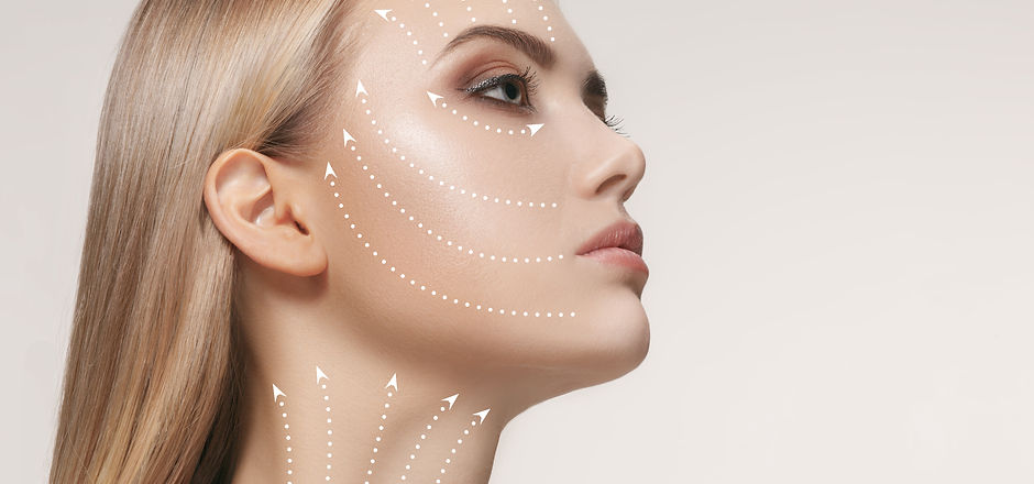 Close-up portrait of young, beautiful and healthy woman with arrows on her face. The spa,