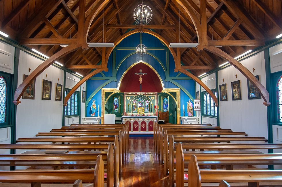 Interior of the restored Church of the Holy Passion in Amberley, showcasing vivid heritage colours—green, blue, and red—symbolising the tree of life, living water from Christ’s side, and His sacrificial blood, respectively. Architectural details are highlighted with 23.5k gold leaf.