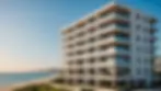 Eye-level view of a modern apartment building near the beach