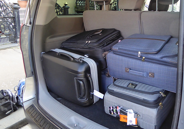 Back of Van with Suitcases from the sice