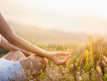 Woman meditating in a field