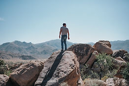 Man Standing on Rocks