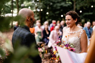 bride and groom during their ceremony in the woods at Teybrook Orchard, the Browning Brothers Essex wedding venue