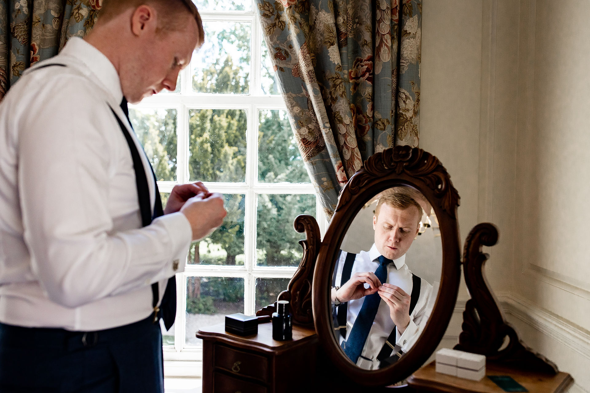 Groom gets ready at his relaxed Norfolk wedding