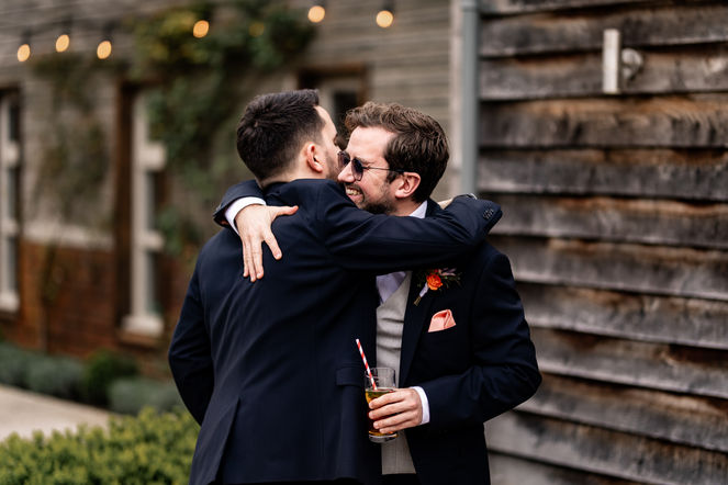 Drinks and hugs in the courtyard at Houchins after the ceremony